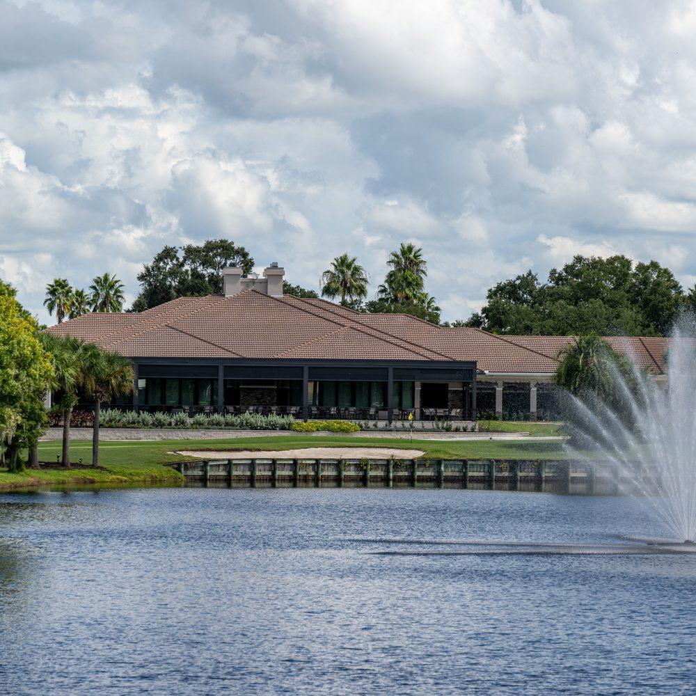 Heritage Oaks clubhouse viewed from across the water