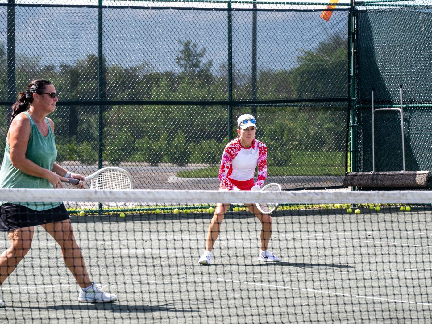 Members taking part in a tennis clinic at Heritage Oaks