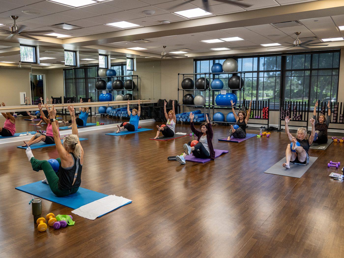 A member training with a personal trainer at Heritage Oaks
